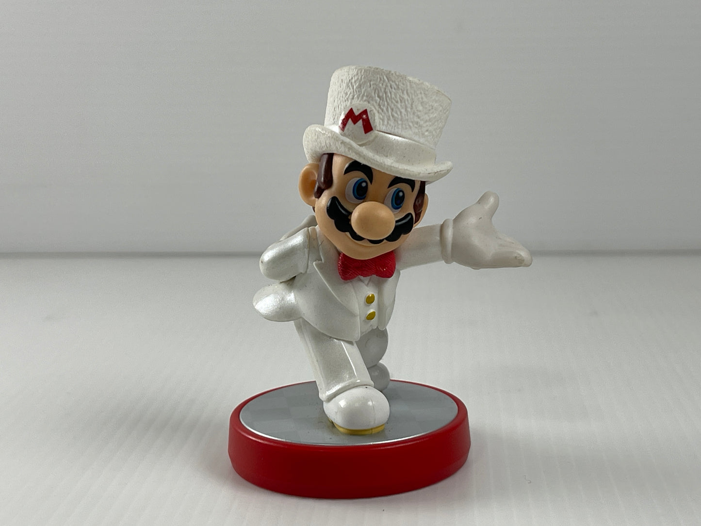 Nintendo Amiibo Mario in a white tuxedo and top hat figure